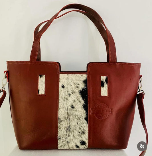 Handmade leather bag with a touch of cow-hide